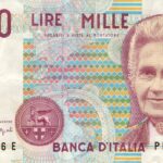 Moneta da 5 Lire con delfino, simbolo di valore collezionistico, su sfondo neutro.